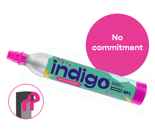 Indigo-branded CO₂ cylinder with bright pink tip, labeled “Easy Connect”, set against a white background with a pink circle reading “No commitment”. A pink pictogram in the lower left corner illustrates compatibility with SodaStream's Quick Connect system.